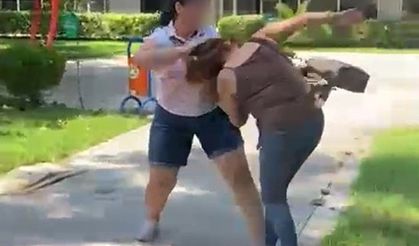 Kocasıyla birlikte parkta bastığı kadını saçından sürükledi